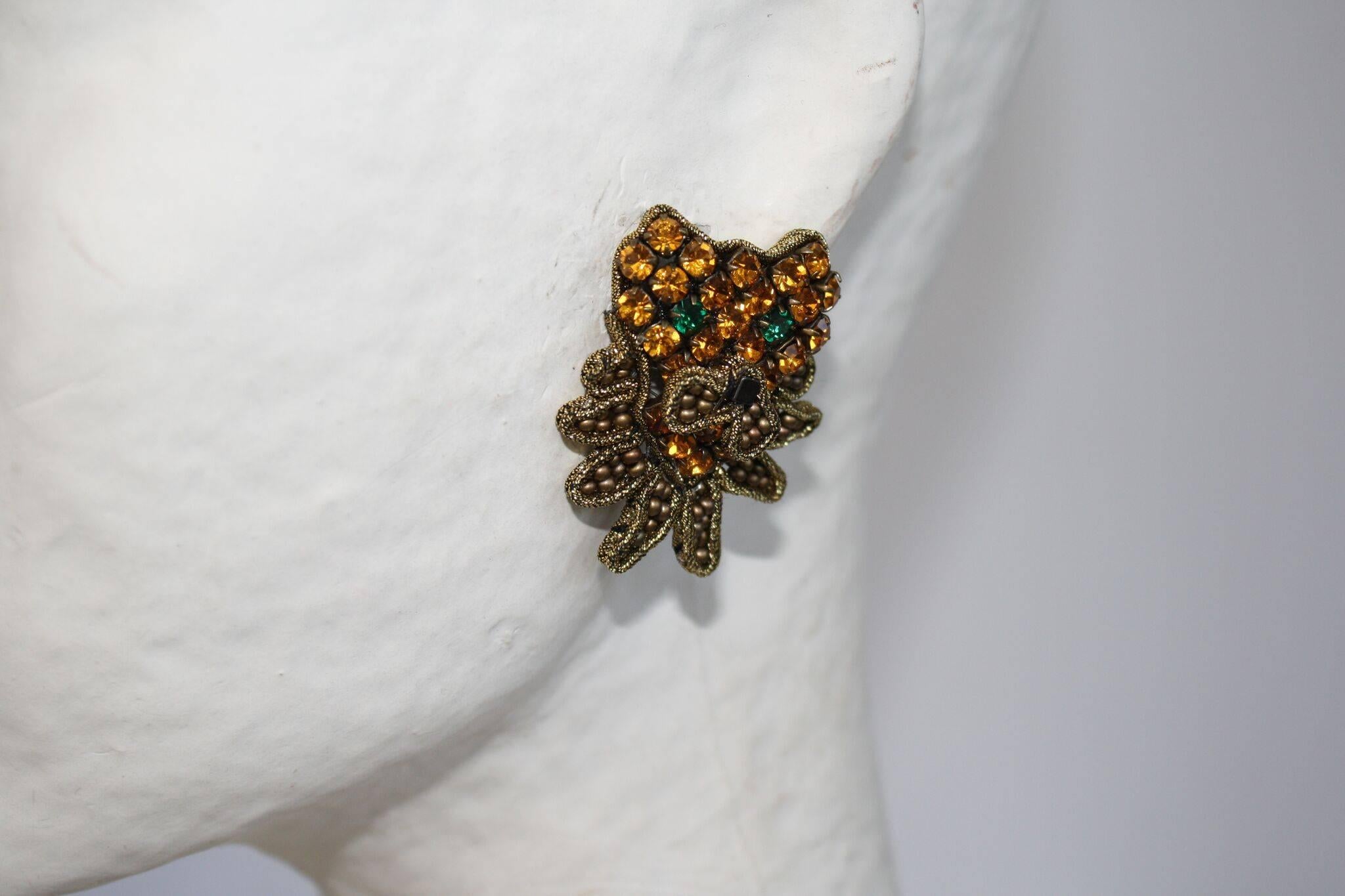 Swarovski Crystal, glass bead, and lurex ribbon lion inspired pierced earrings from Italian designer Tataborello.