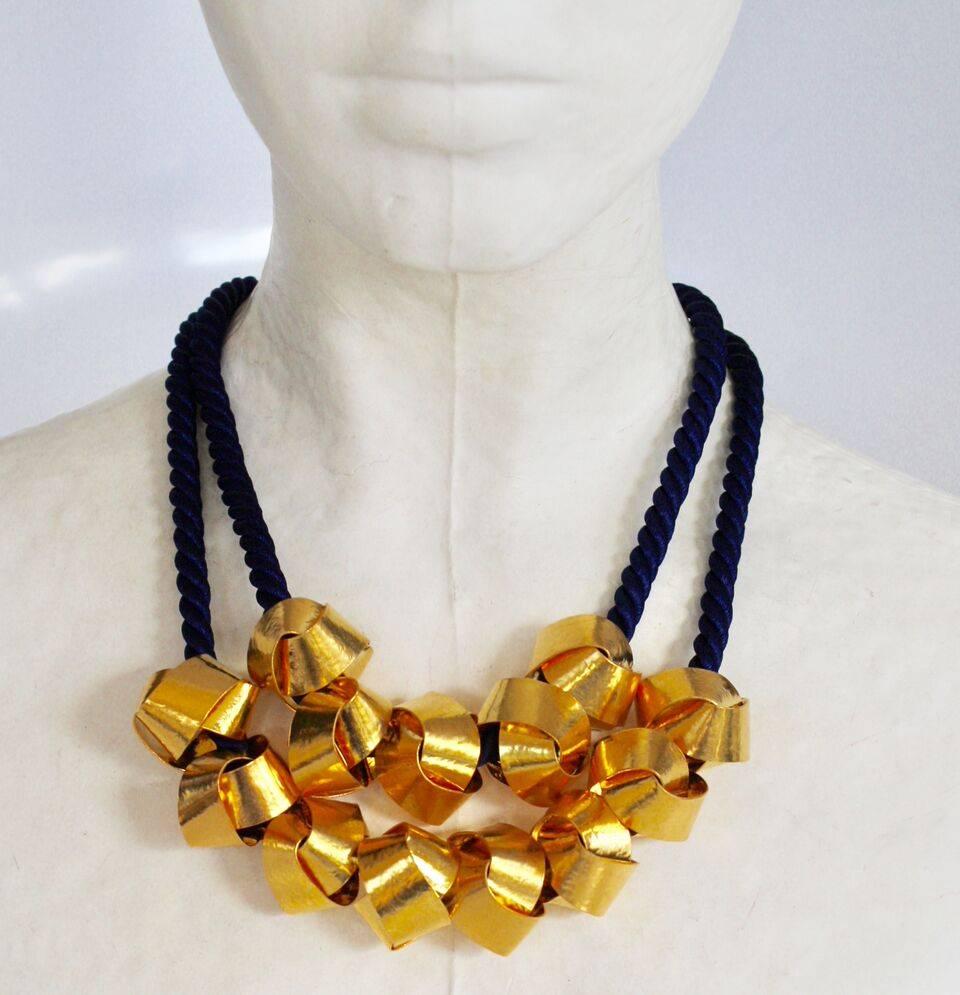 Gilded brass and blue cord statement necklace from Herve van der Straeten. 