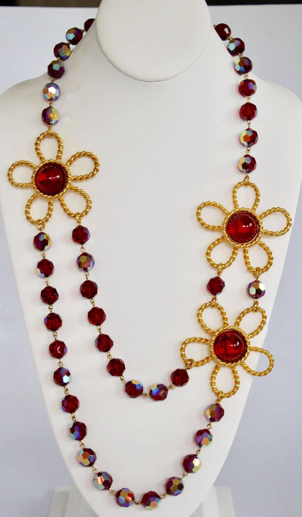 Red handmade glass bead and gilde4d brass flower necklace from Francoise Montague. Handmade glass pearls