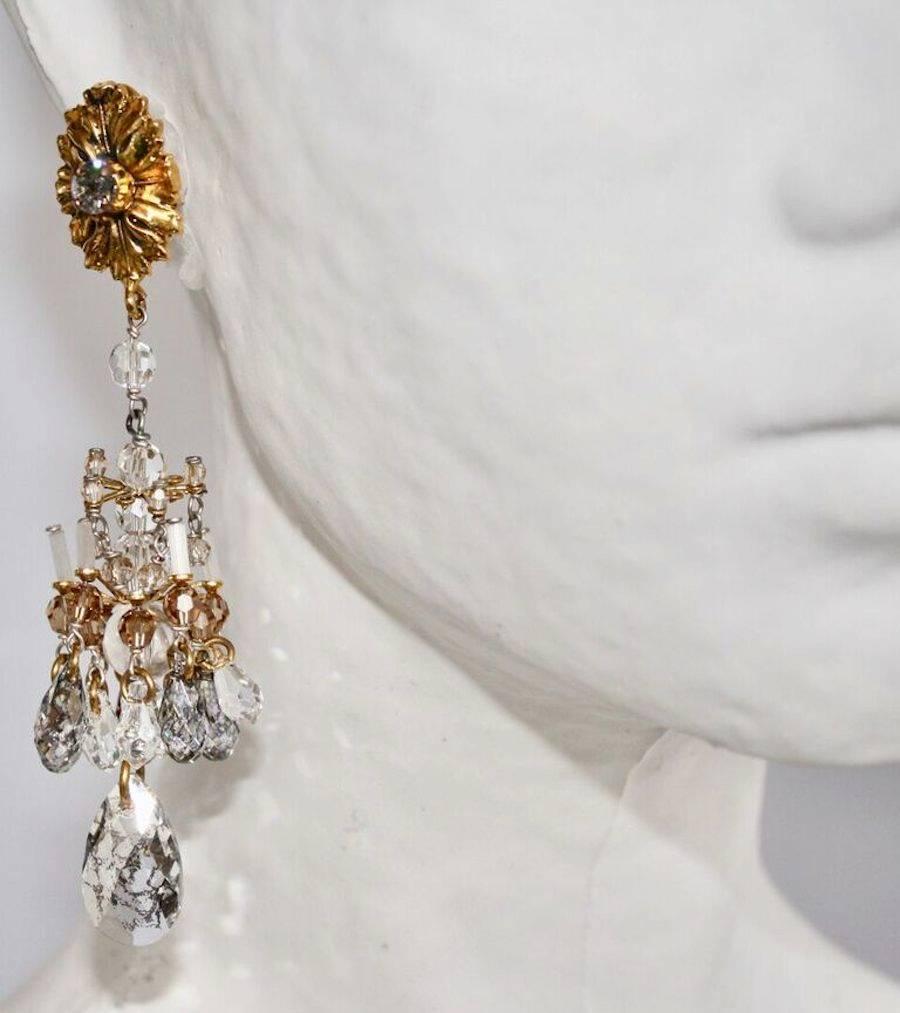 Glass, crystal, and gilded brass statement chandelier earrings from Philippe Ferrandis. Pierced. 