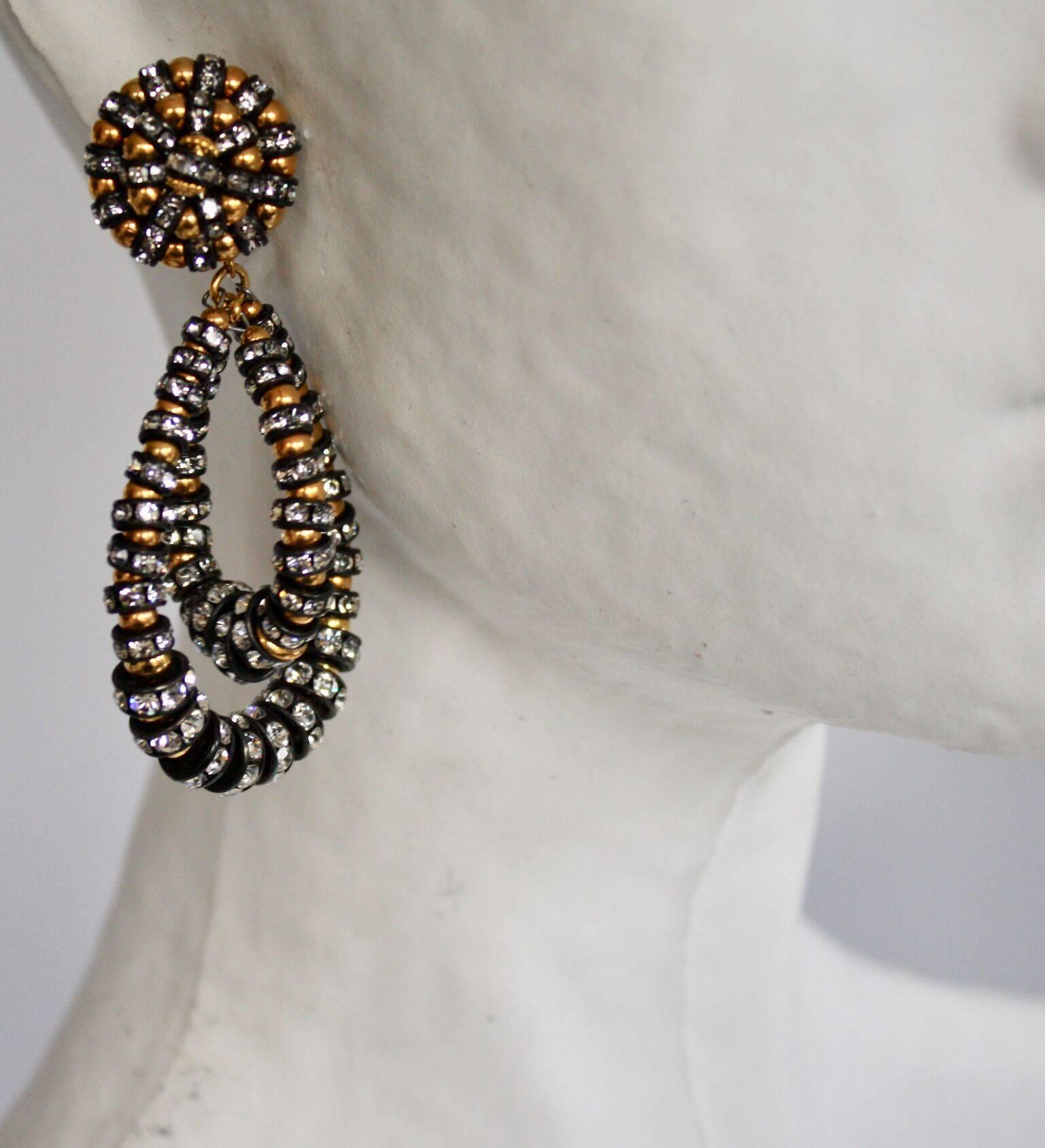 Medium Lolita clip earrings in gold, black metal, and Swarovski crystal. 

 