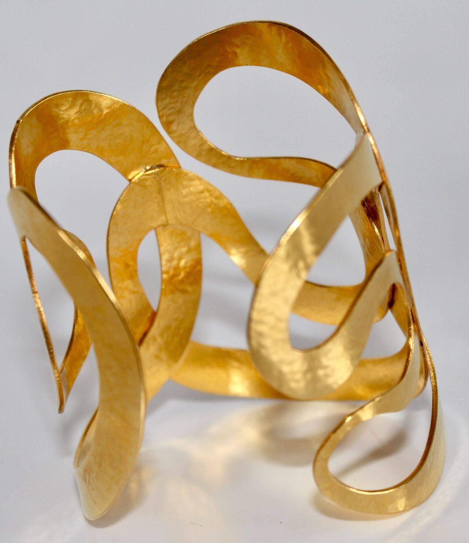 Herve van der Straeten has stopped producing jewelry, all remaining pieces from this designer are collectors items!

Multi ribbon curved gilded brass lightweight cuff bracelet. 