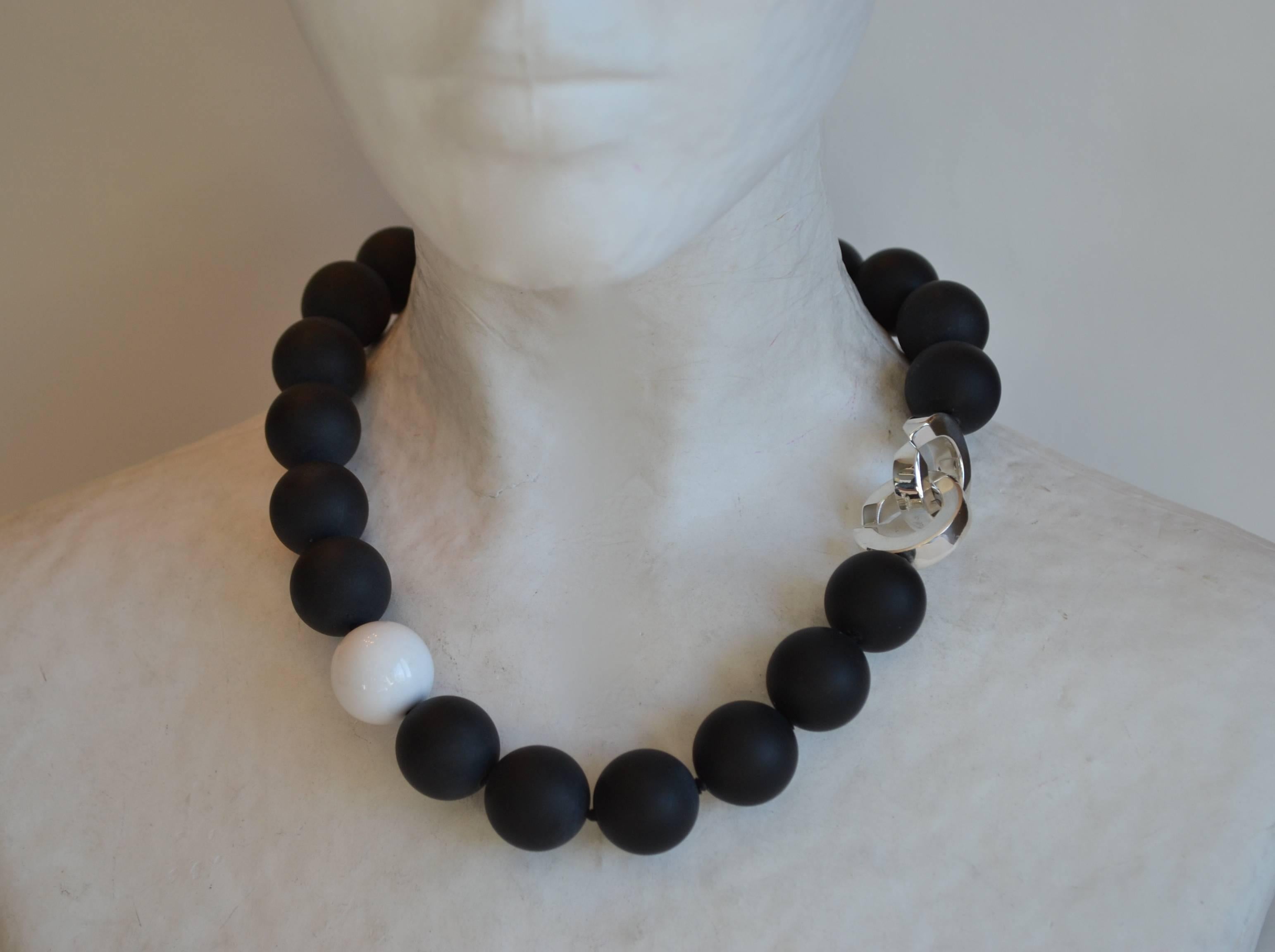 Satin black onyx and white coral bead necklace with solid sterling silver clasp from Patricia von Musulin. 