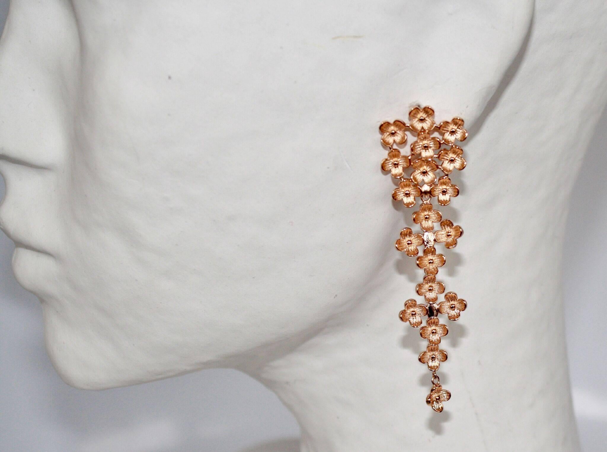 Daisy motif pierced statement earrings in rose gold from French designers Ambre et Louise. 