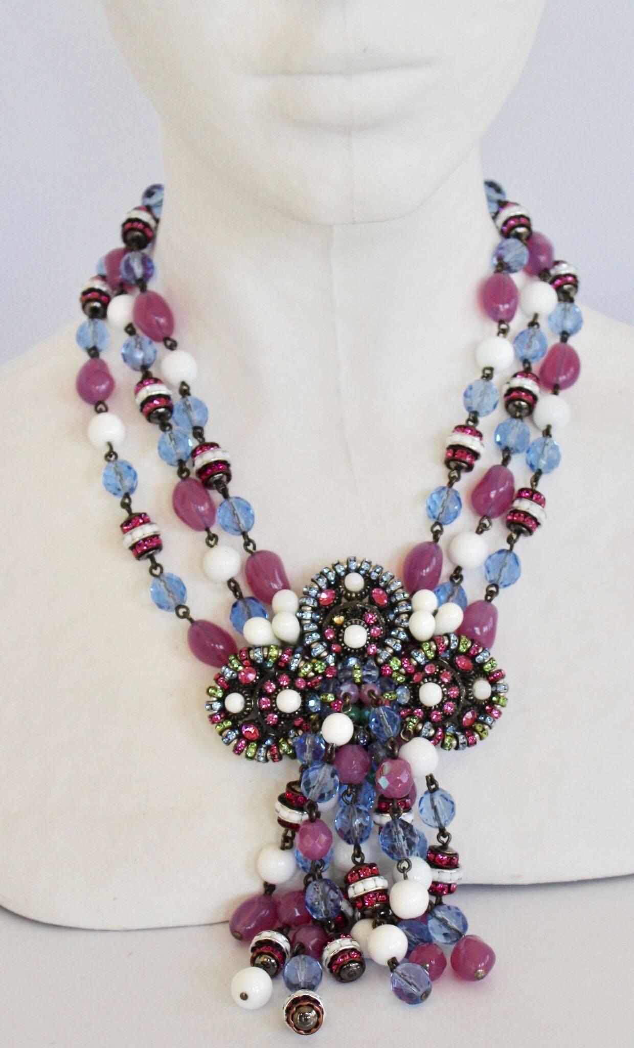 Handmade statement necklace from Francoise Montague. The center features a fabulous Swarovski crystal and glass bead floral shaped motif. 