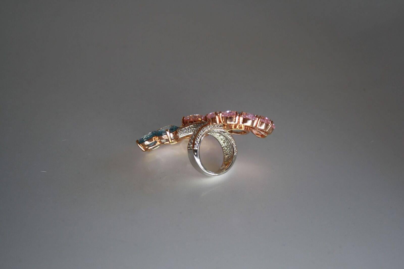 An extravagant cocktail ring made with clear, blue, pink, and yellow Zircon from Italian brand Ultima Edizione. Size 7. 