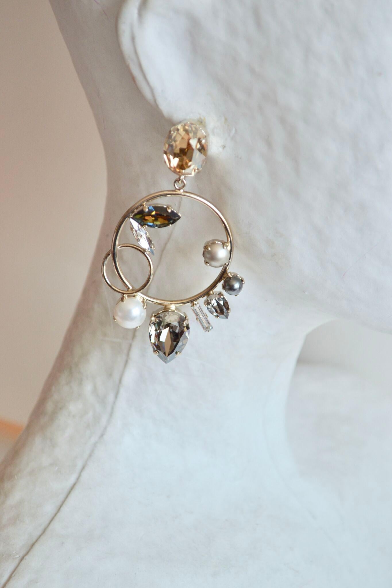 Champagne crystal topped clip earrings with circle drop adorned further with Swarovski crystals and glass pearls. Made by French designer Philippe Ferrandis. 