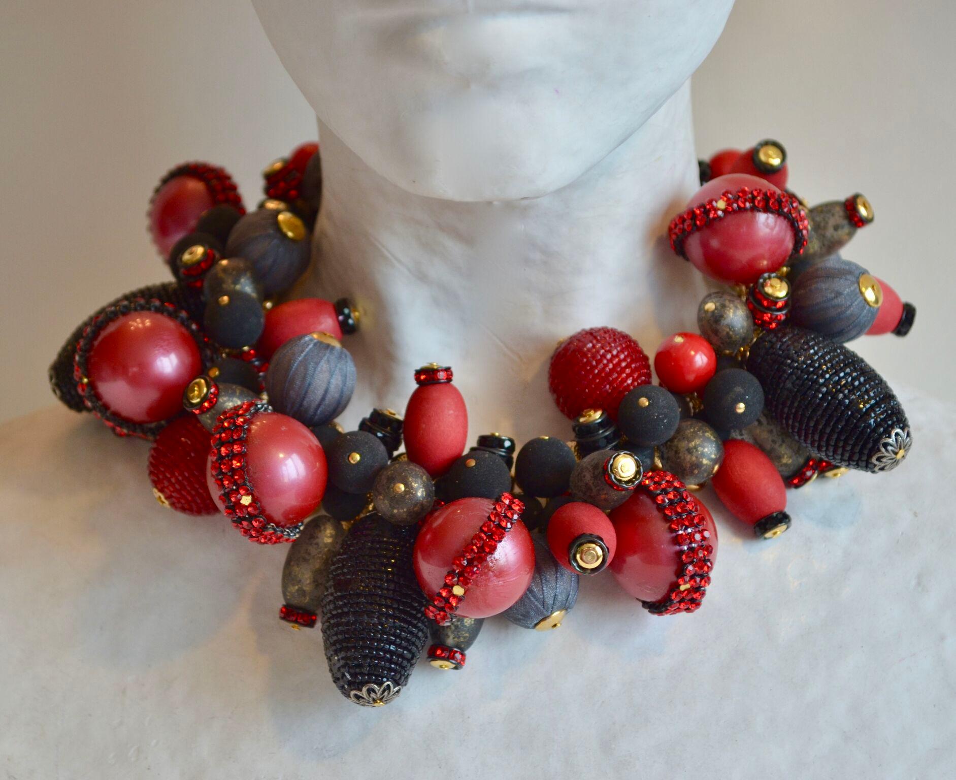 Vintage glass beads in shades of red, grey, and black are strung together on a fabulous gold chain  in this statement piece from design house Francoise Montague. Hand made in Paris. 