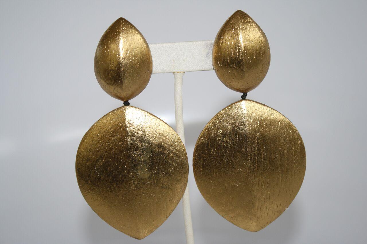 Lightweight statement clip earrings from Monies Denmark in wood with gold leaf. 