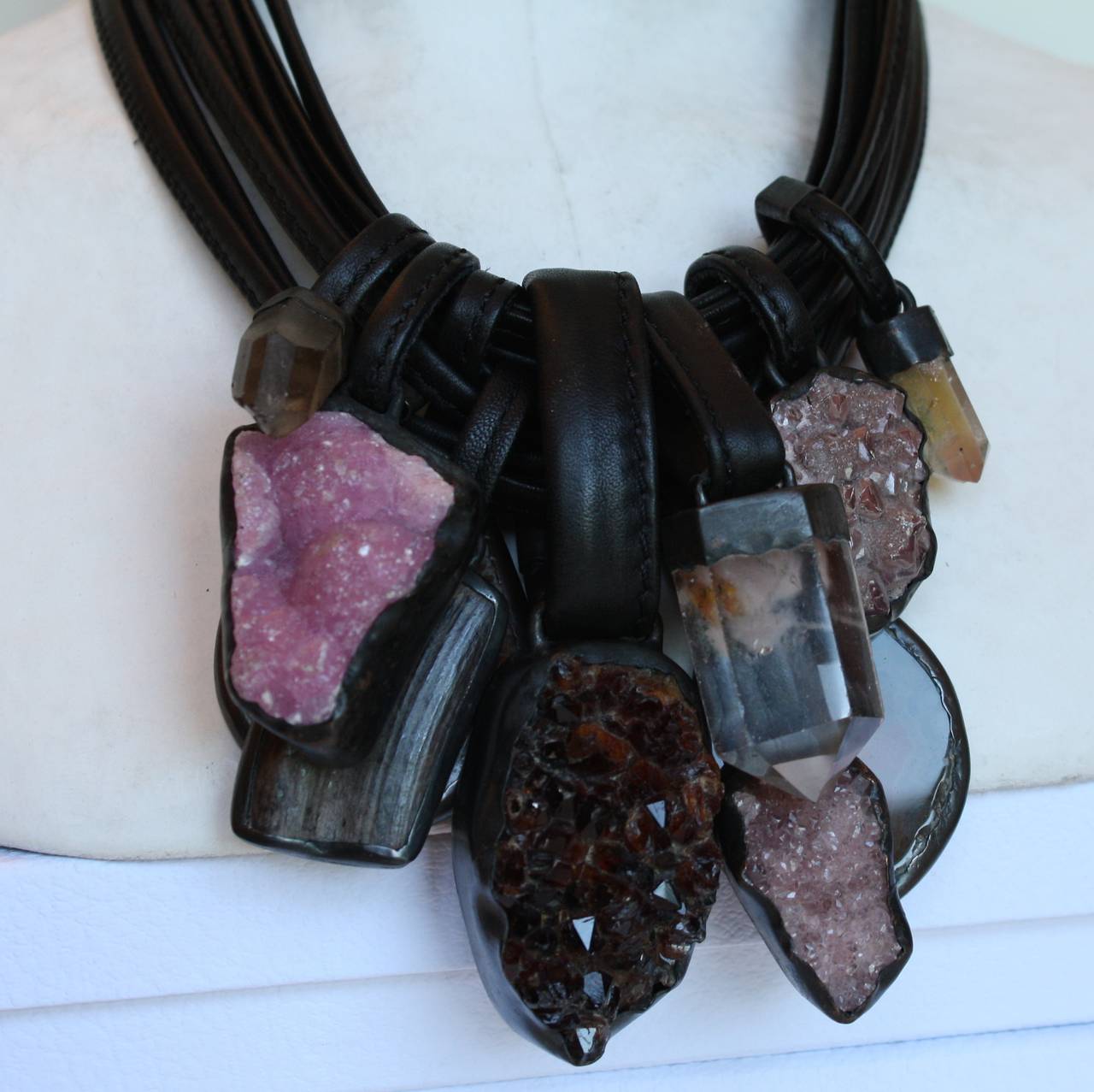 A one of a kind creation from Monies made with leather, fluorite, agate, ebony wood, mountain crystal, and warthog. 

Designer Biography:

Monies is a Danish jewelry company founded by Gerda and Nikolai Monies. We are trained goldsmiths with