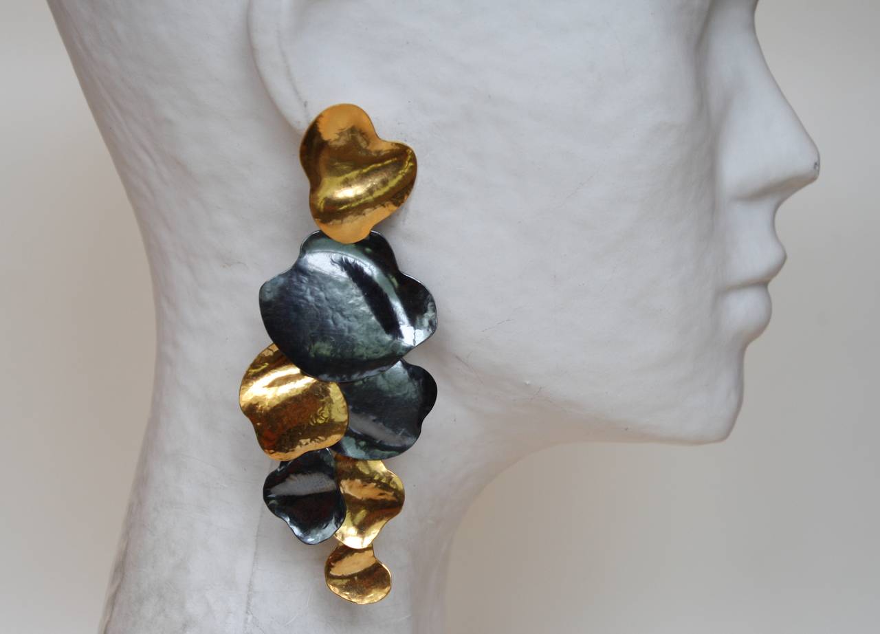 Gold plated brass and oxidized silver plated brass clip earrings from famed jewelry designer Herve van der Straeten. 

4