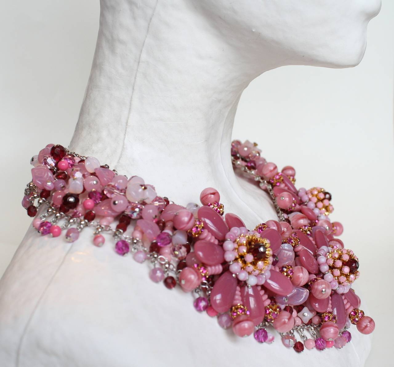 In her signature style, Francoise Montague has created a timeless statement necklace comprised of varying shades of pink glass beads and Swarovski crystals. Hand made in Paris, France. 

14