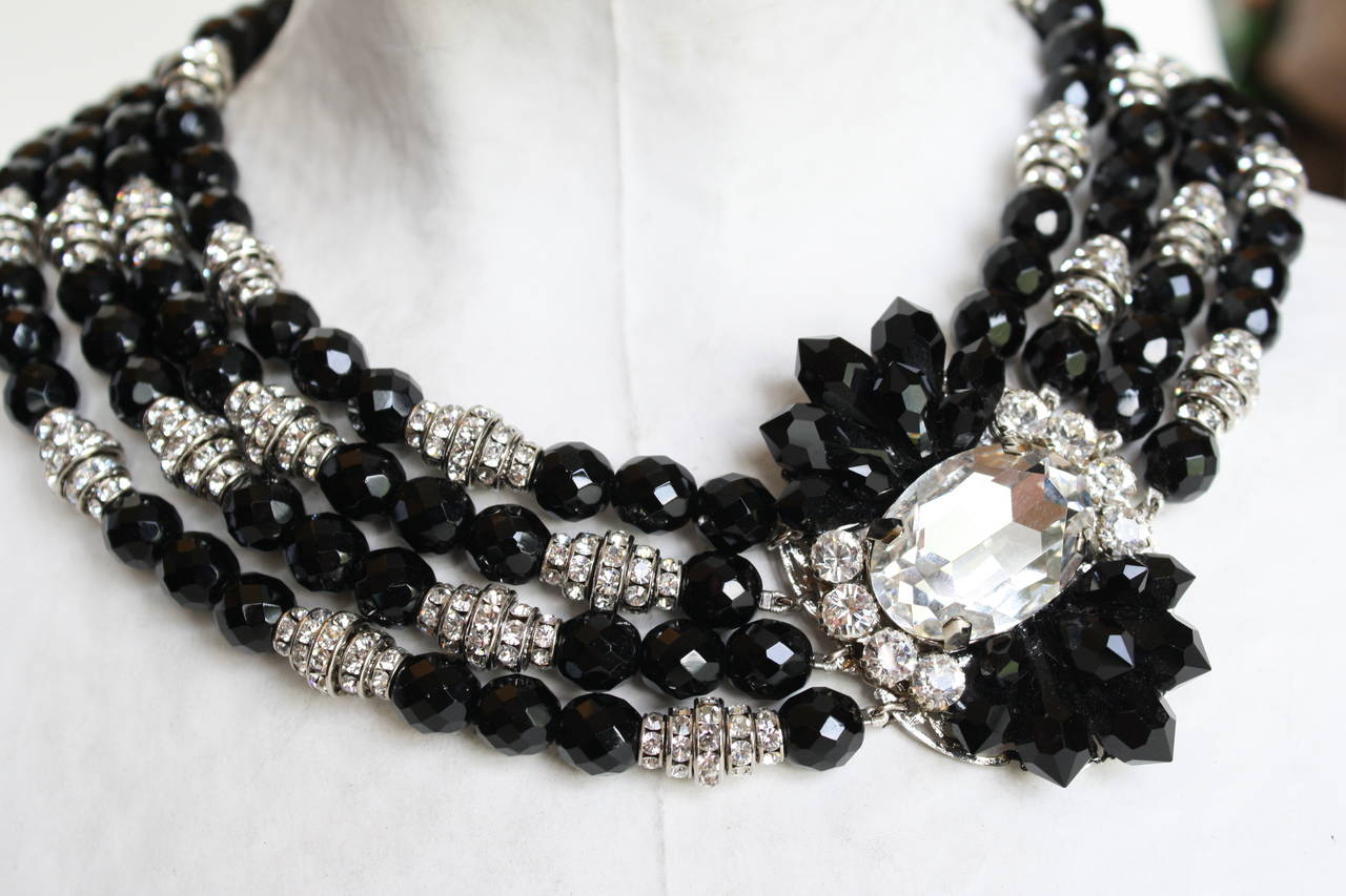 Handmade in Paris, France, this necklace from Francoise Montague is a showstopper. Swarovski crystal rondelles are paired with black glass beads and a large Swarovski Crystal center stone to create a true work of art. Finished with a decorative