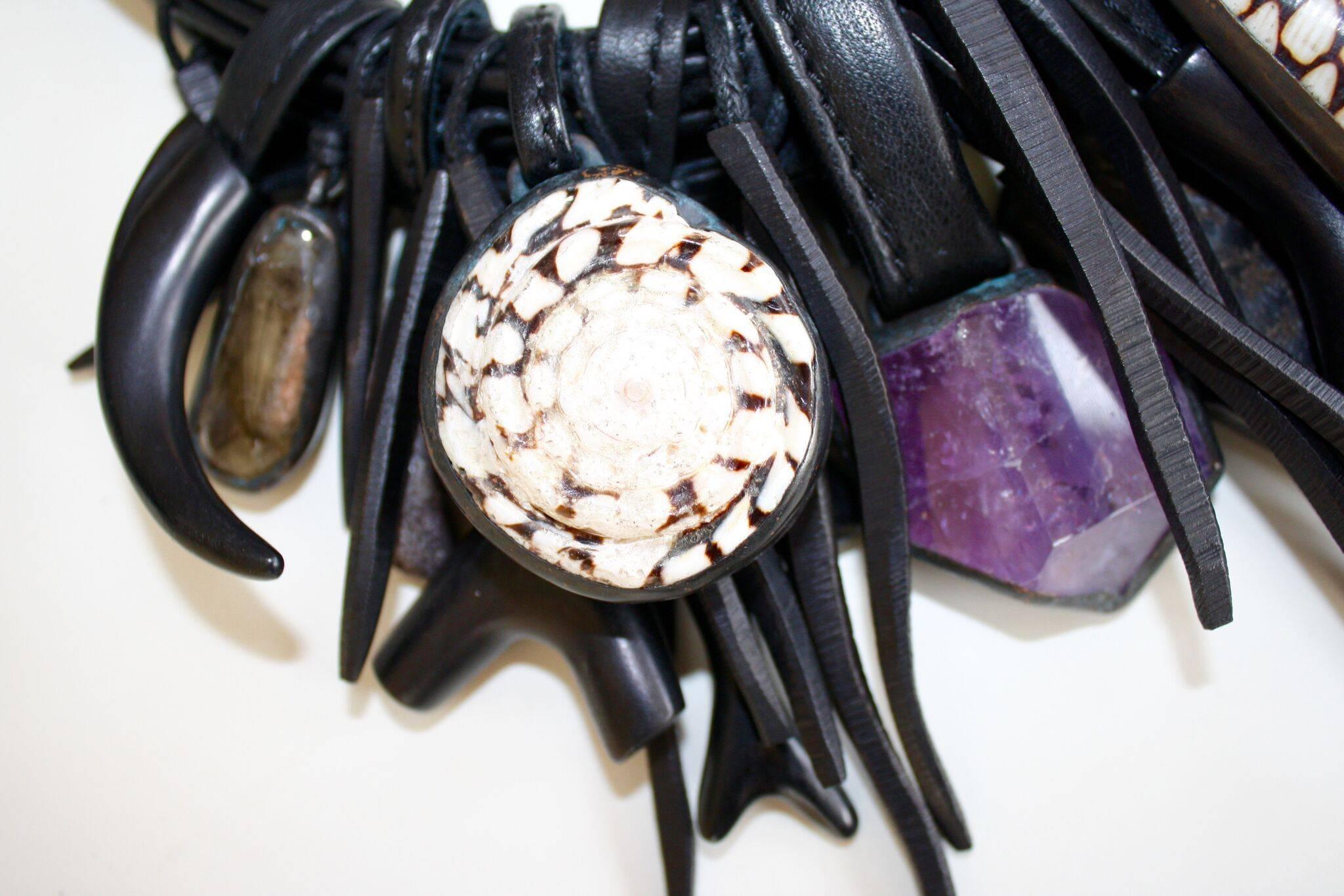 One of a kind amethyst, horn, shell, warthog, ebony, leather and mountain crystal necklace from Monies. 

17