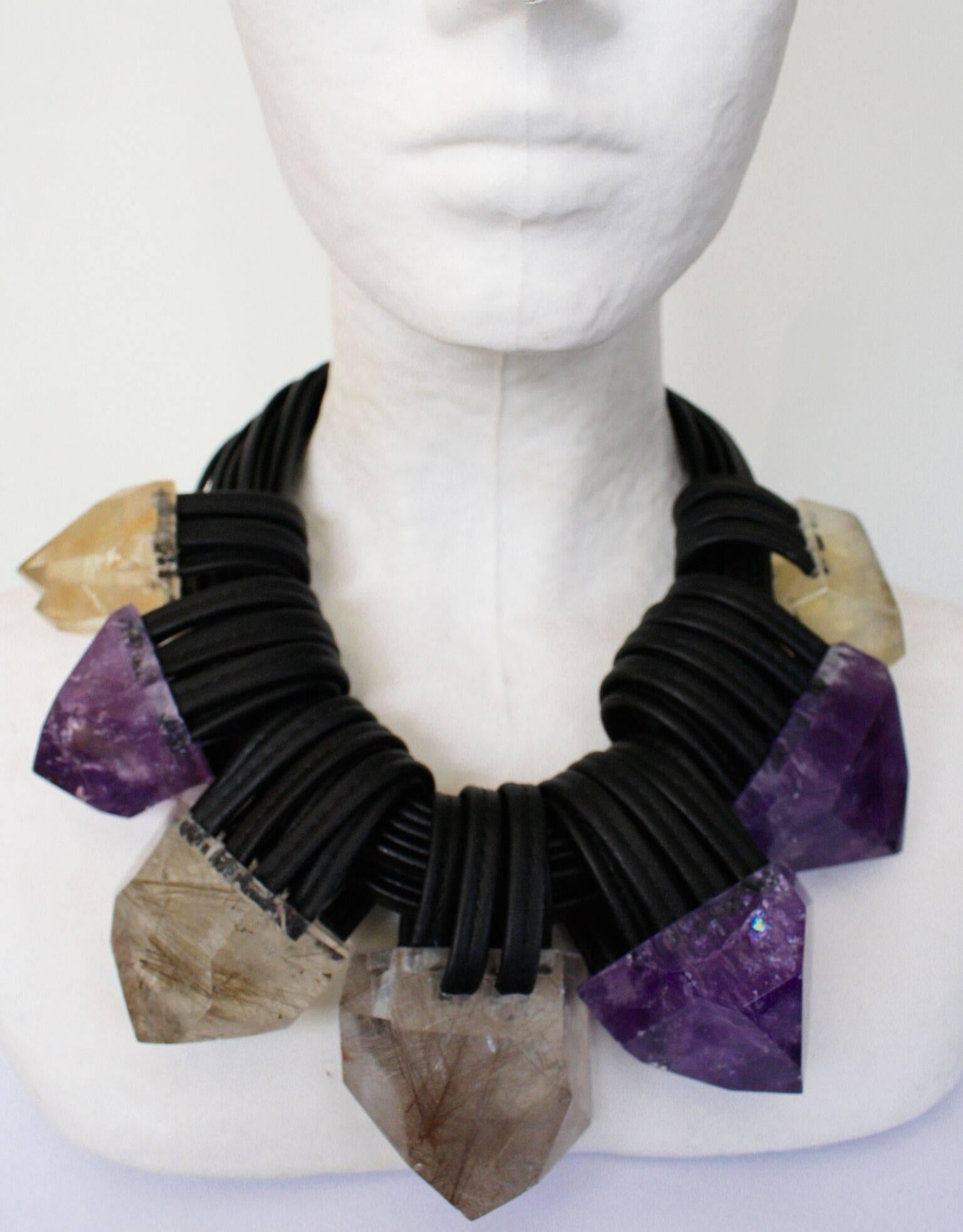 An exceptional one of a kind creation from Monies made with raw citrine, faceted citrine, amethyst, ebony and leather. 

17