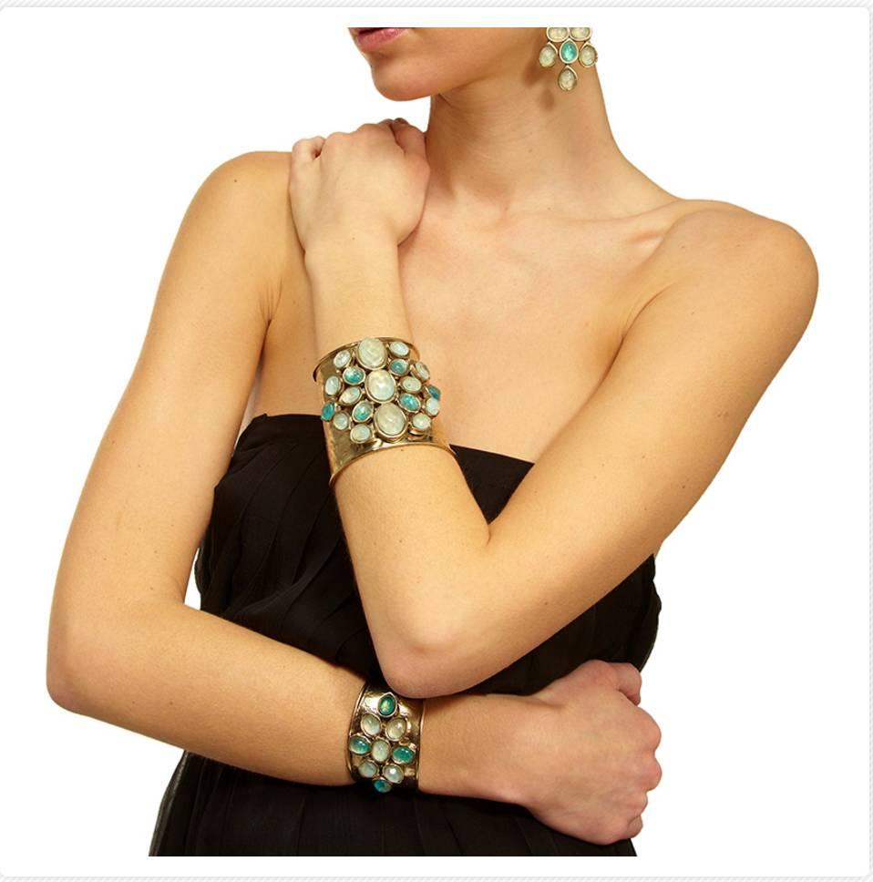 Unmissable, this large cuff in hammered gold plated bronze is enhanced by rock crystal cabochons. 

Cuff is malleable and will fit both small and large wrists. 

Designer Biography:

Robert Goossens holds a special place in the prestigious