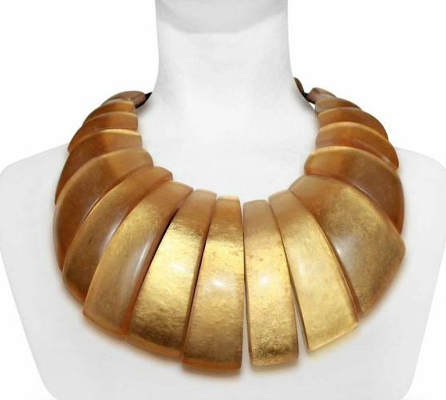 Lightweight acrylic and gold leaf statement necklace from Monies.

Designer Biography: 

Monies is a Danish jewelry company founded by Gerda and Nikolai Monies. We are trained goldsmiths with experience from Denmark, Germany, England, Italy and