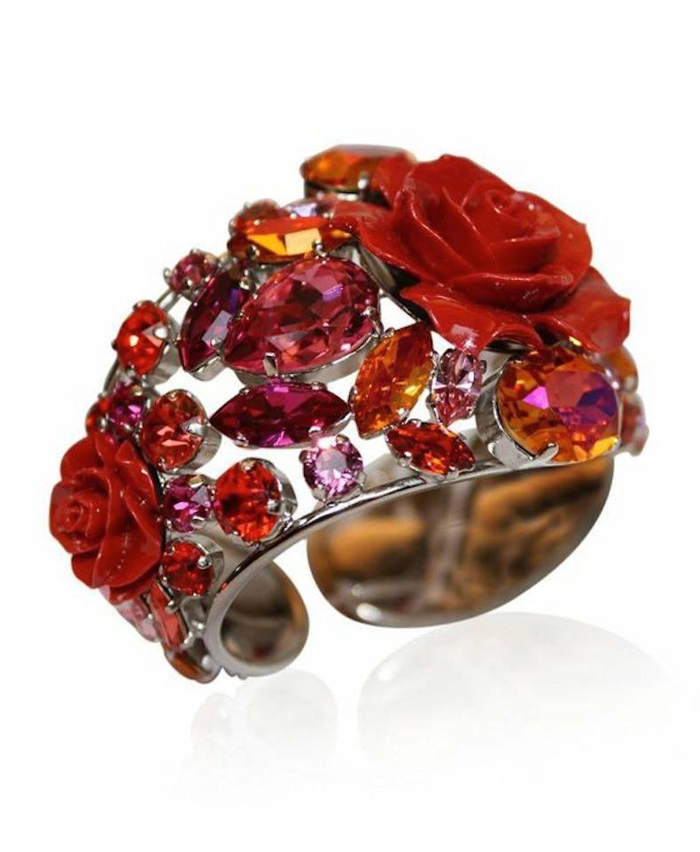 Philippe Ferrandis red resin rose cuff with pink and orange Swarovski Crystals. Cuff is adjustable and fits both large and small wrists. 

Designer Biography: 

Philippe Ferrandis has been designing costume fashion jewelry and accessories since