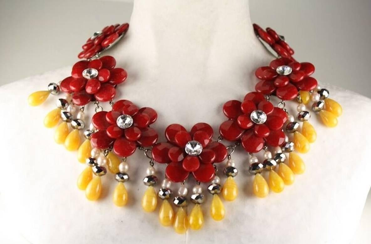 Francoise Montague necklace with seven red agate flowers, Swarovski crystals, glass pearl and yellow agate drops.

15" width
5" extension chain

Designer Biography:

La maison Françoise Montague has been recognized and respected in