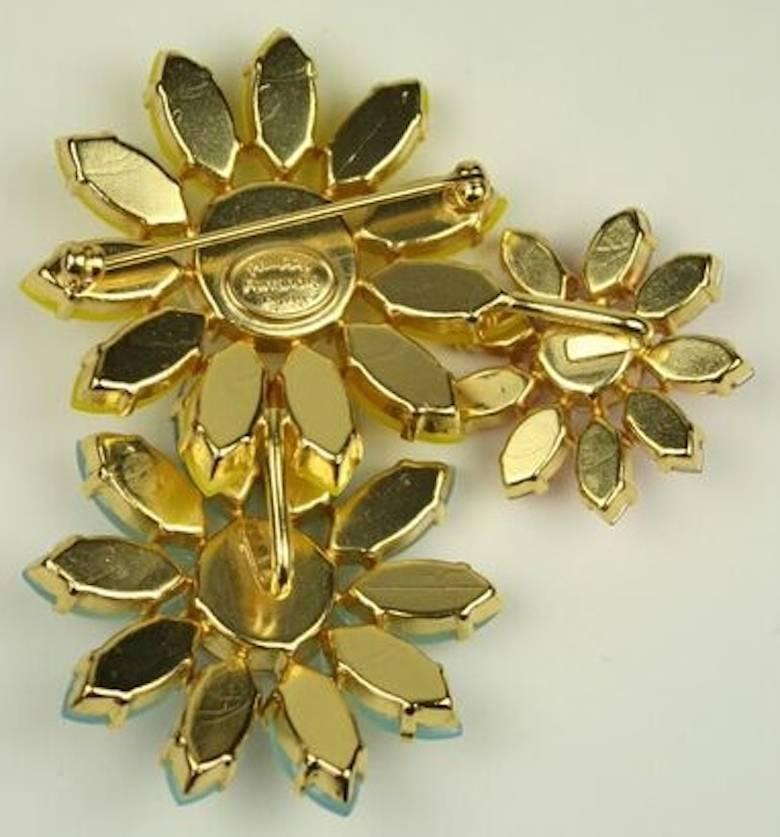 Handmade glass cabochon and Swarovski crystal triple daisy pin from Philippe Ferrandis. 

3
