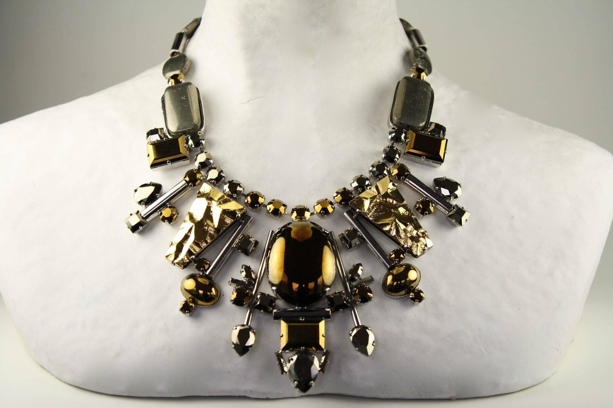 Pyrite, handmade glass cabochons, gold and silver metallic treatment necklace from Philippe Ferrandis' spring 2016 collection. 

15