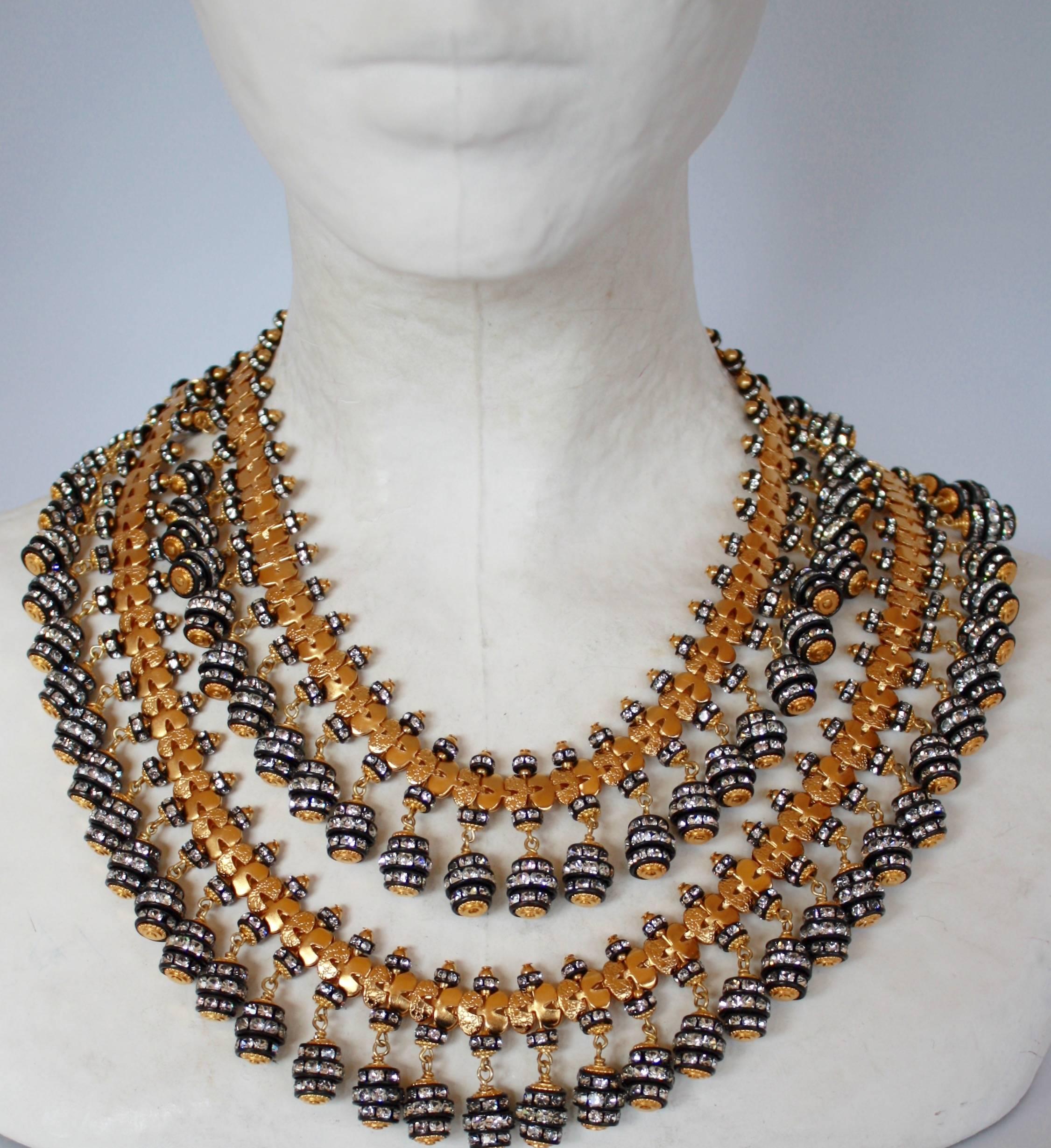 Antiqued gold chain with black metal and Swarovski Crystal Rondelle drops from Francoise Montague.

16