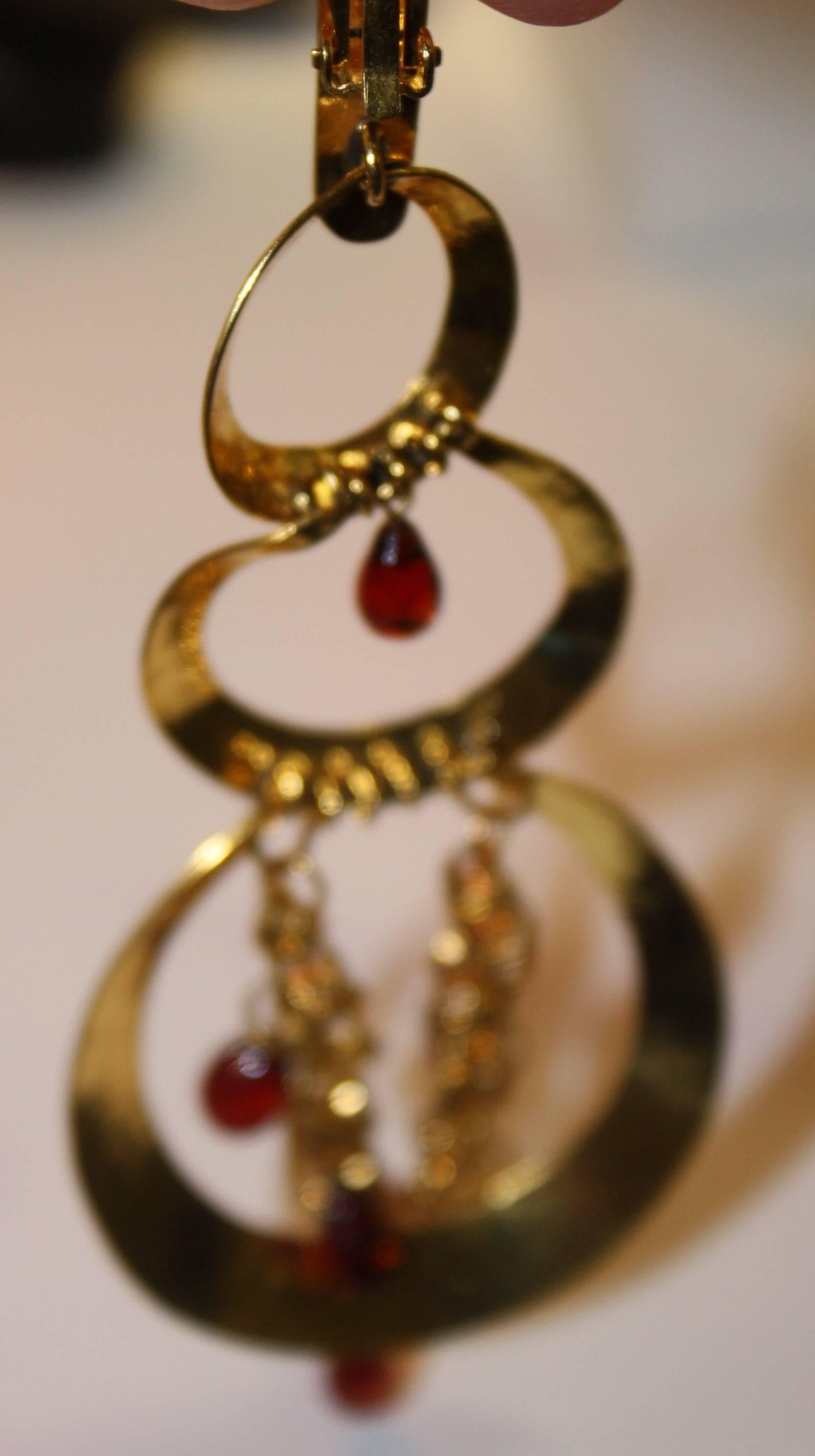 Herve Van Der Straeten gold plated bronze clip earrings with garnet drops. Light as a feather and gorgeous.

4.25