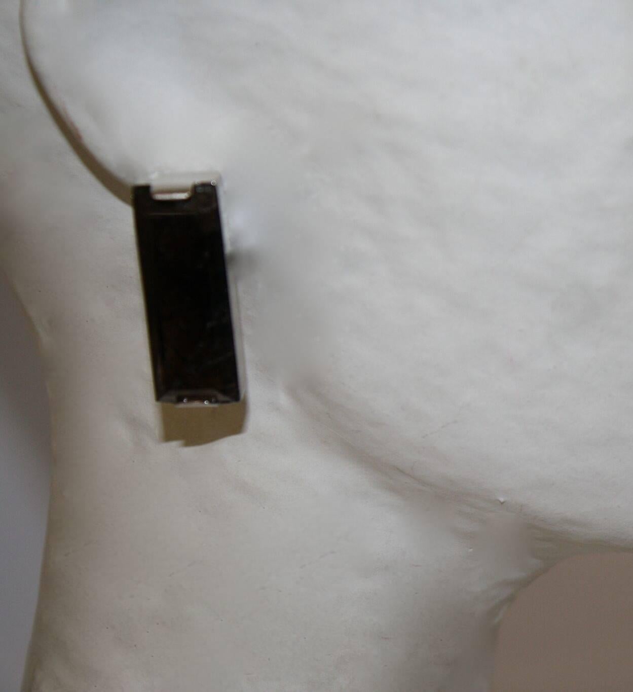 Single rectangular clip earrings in smoky rock crystal set in palladium from Goossens Paris. 