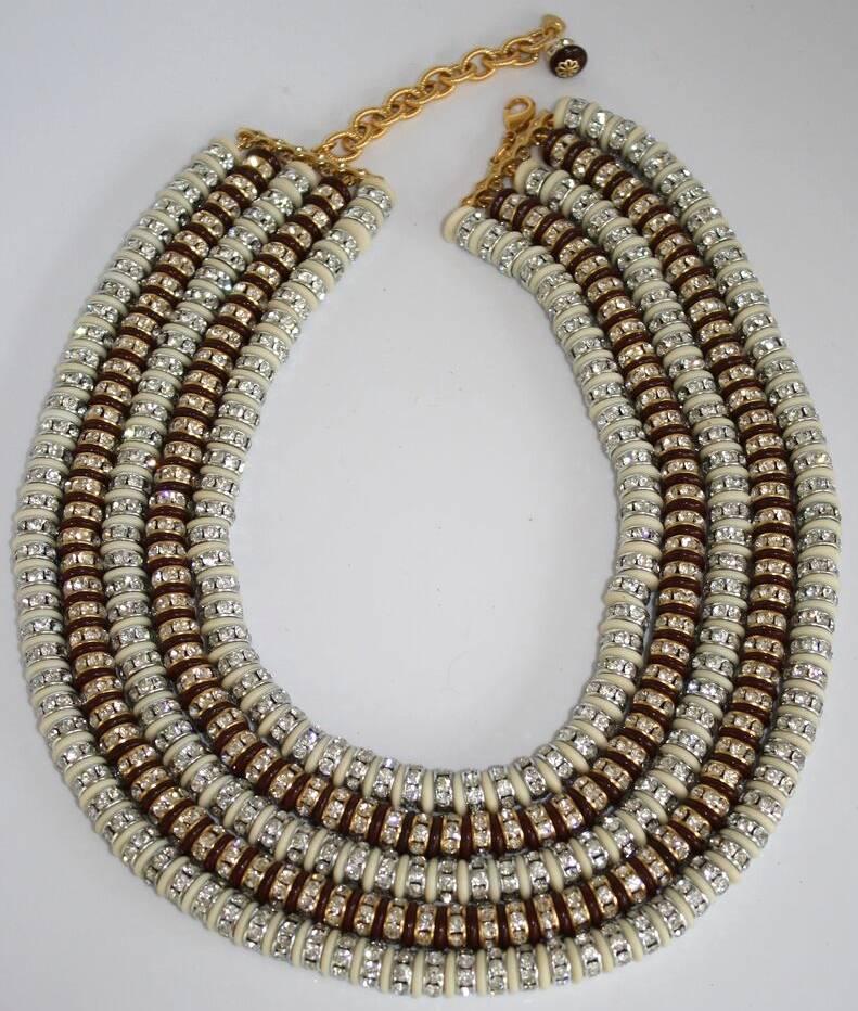 Ivory and brown glass rondelles are strung between silver and clear Swarovski crystal rondelles in this five strand necklace from Francoise Montague. This piece is incredibly lightweight, despite its large stature. A gorgeous addition to any