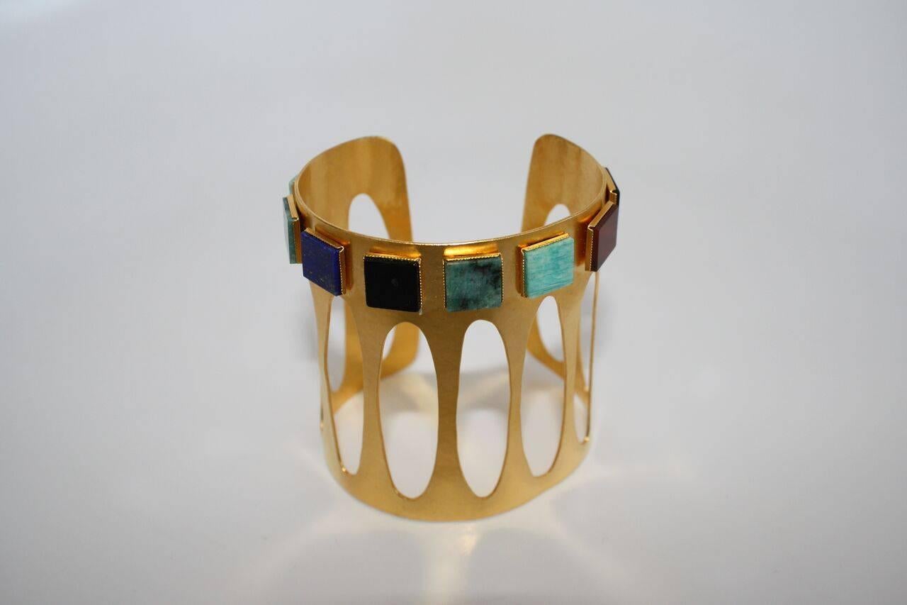 Herve van der Straeten Geometric Bracelet w/ Amazonite, Onyx, Lapis, & Cornelian. Bracelet is made with hammered gold plated bronze. Very flexible, can be squeezed smaller or pulled bigger for any wrist size. 

2.75
