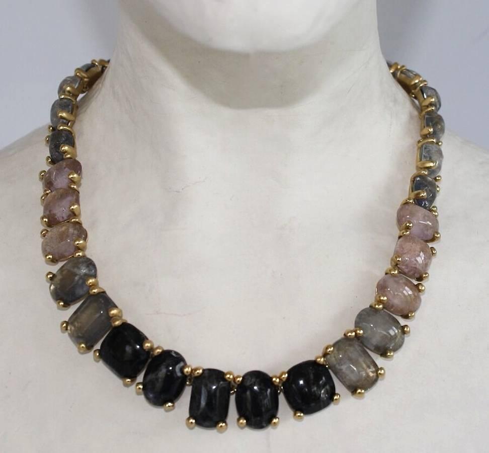 Hand tinted rock crystal and gold plate necklace in shades of Tourmaline and Sapphire from Goossens Paris. 

15.5