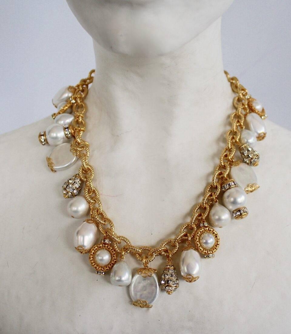 Glass pearl and Swarovski crystal charm necklace on antique chain from Francoise Montague. 

16