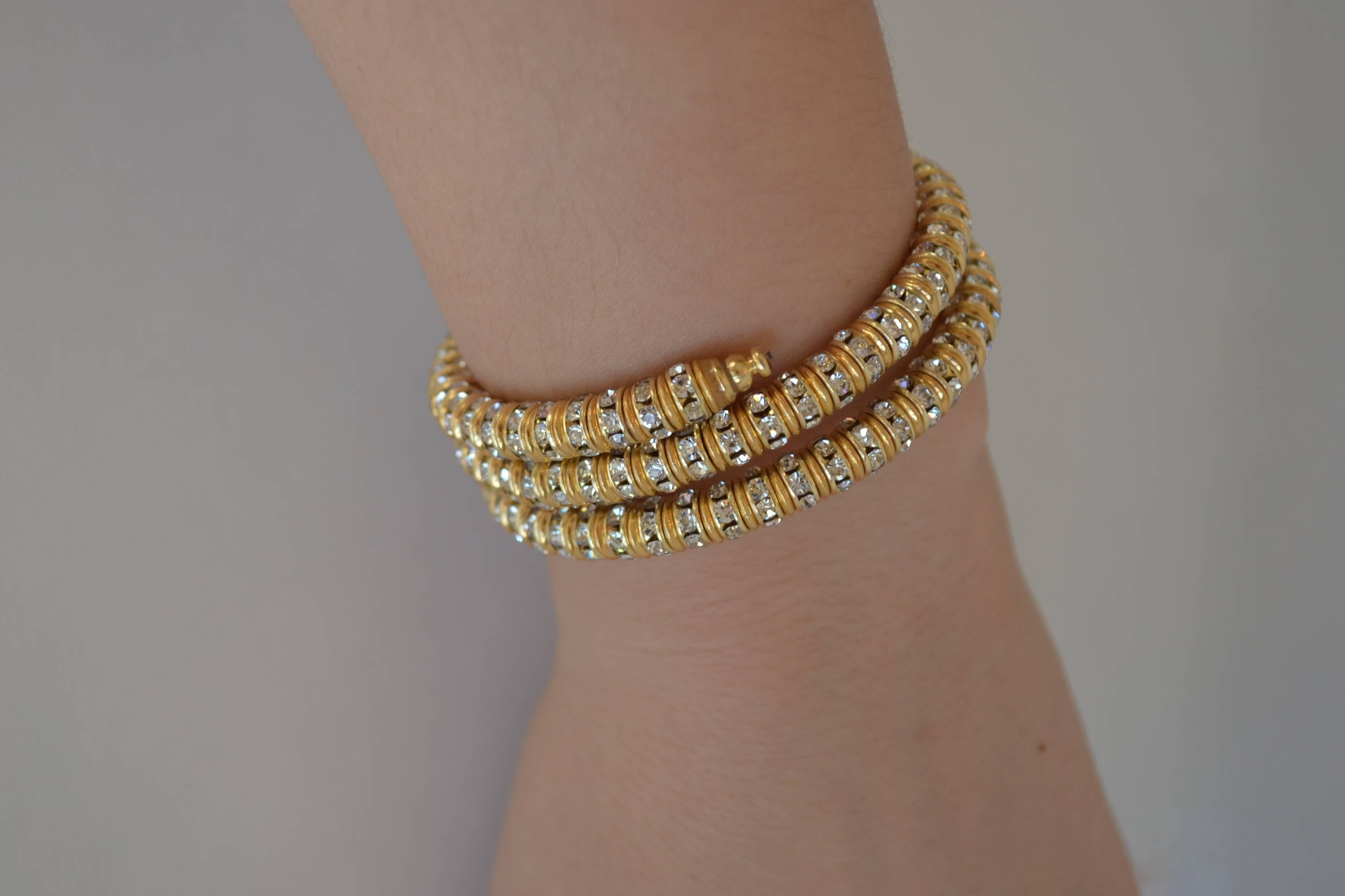 Memory wire wrap bracelet with clear crystal and gold rondelles from Francoise Montague. Fits most wrists both large and small and is easy to take on and off.