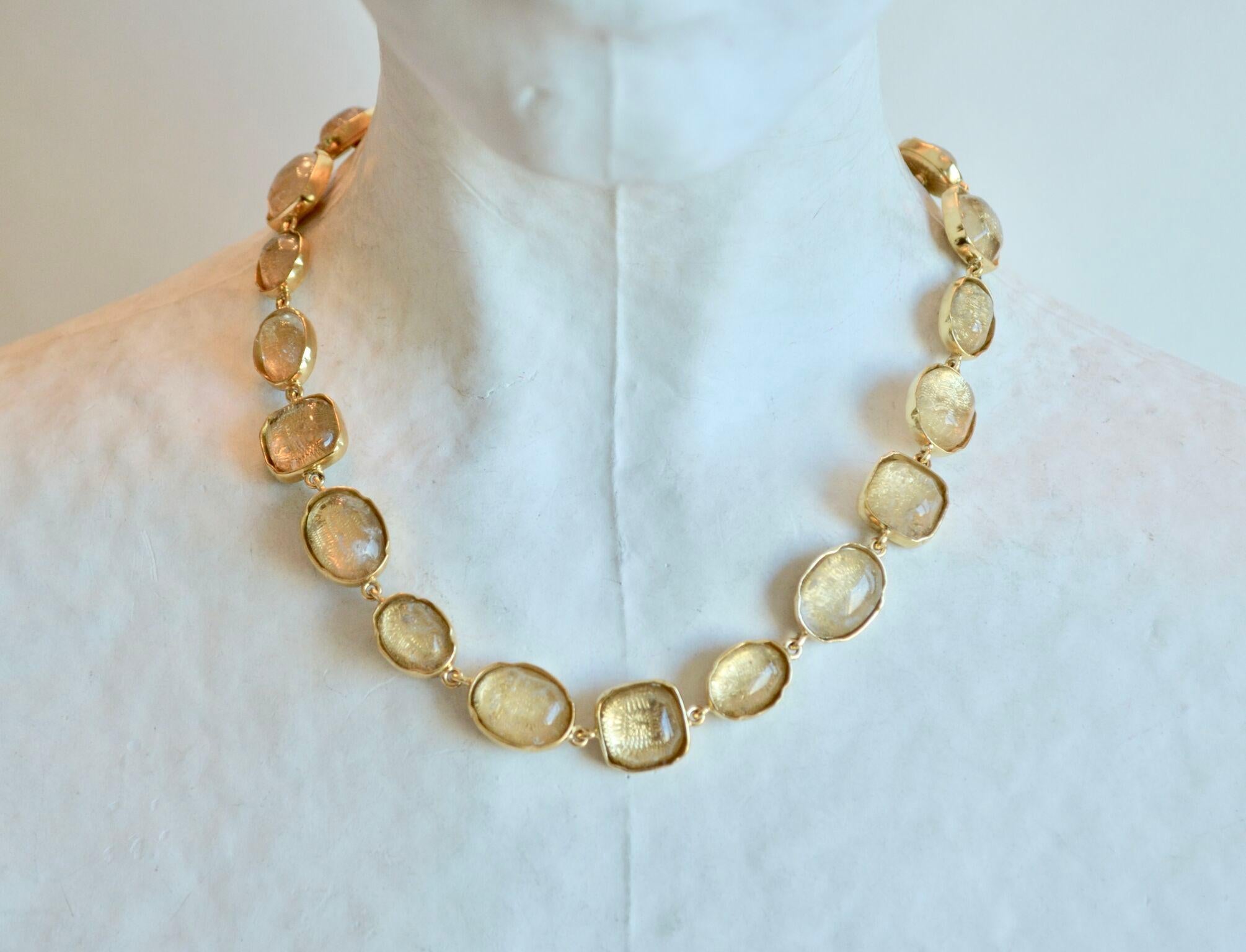 Clear rock crystal necklace set in 24k plated brass from Goossens Paris. 