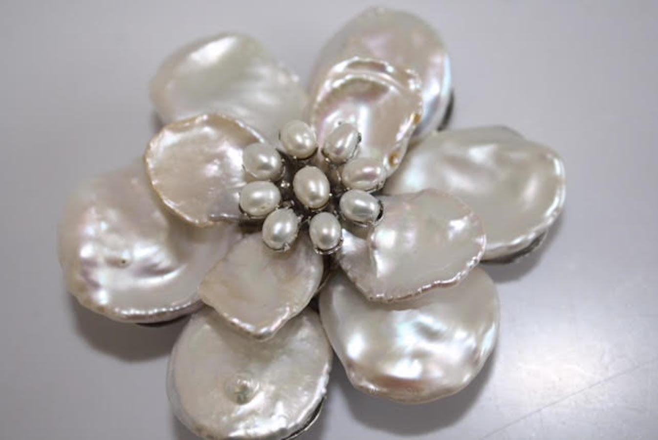 Medium white Keshi pearl flower with pearl center brooch. From Mei's Jewelry, made in NYC. 						