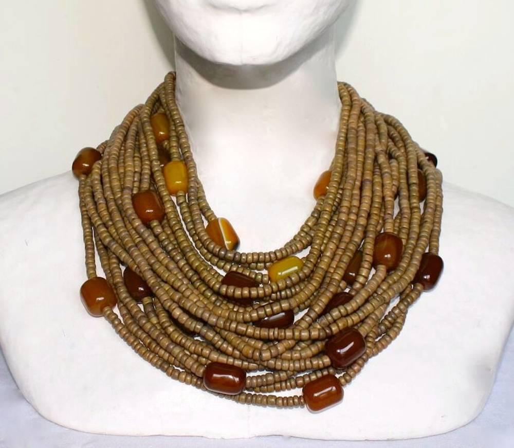 Coco bead, yellow agate, leather and wood clasp one-of-a-kind necklace from Monies. 

Designer Biography:

Monies is a Danish jewelry company founded by Gerda and Nikolai Monies. We are trained goldsmiths with experience from Denmark, Germany,