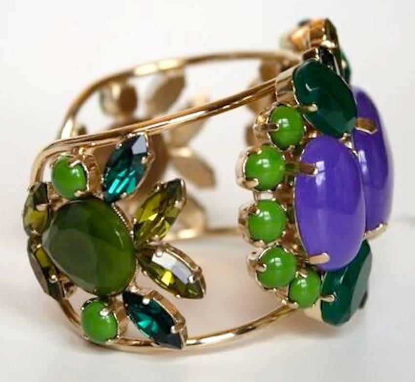 Resin, Swarovski crystal, and glass cabochon bracelet in shades of purple and green from french designer Philippe Ferrandis. 

Designer Biography:

Philippe Ferrandis has been designing costume fashion jewelry and accessories since 1986. Based