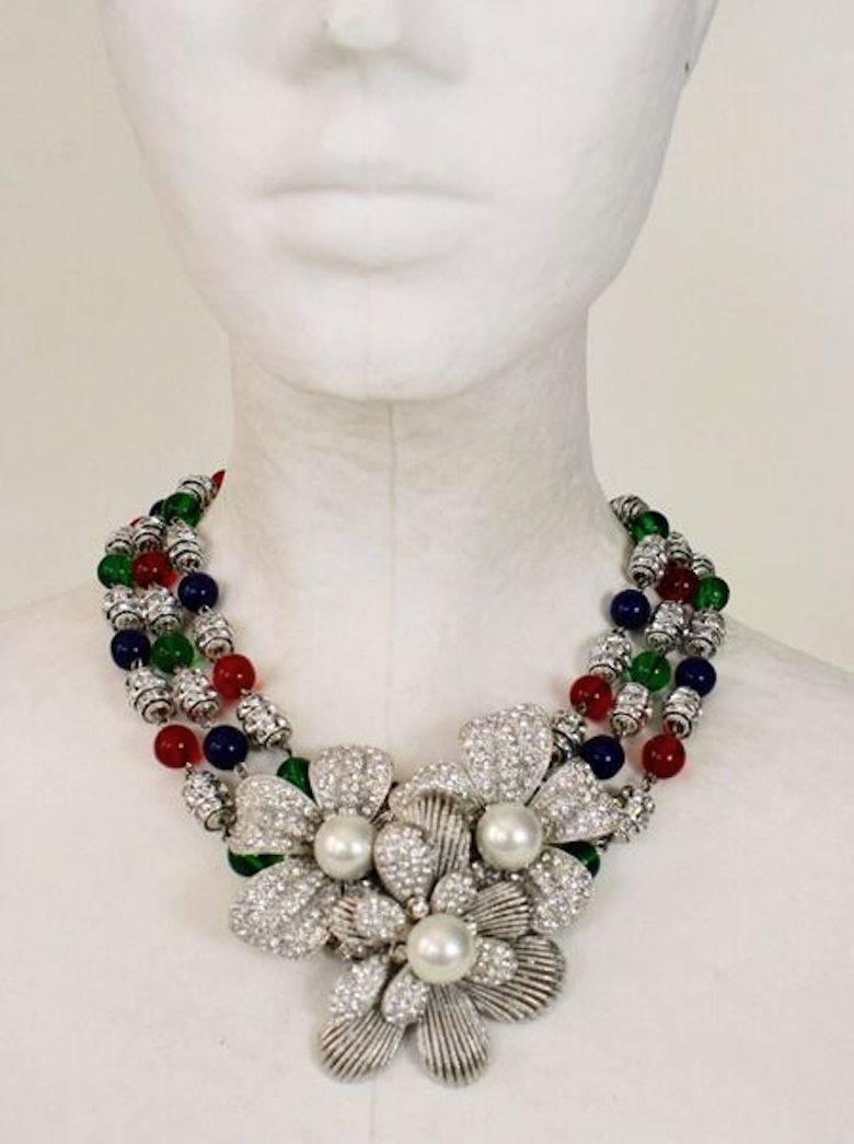 Necklace with red, green, and blue glass beads, Swarovski crystal rondelles, Swarovski crystal petals, and glass pearl center stones from Francoise Montague. 

Designer Biography:

La maison Françoise Montague has been recognized and respected
