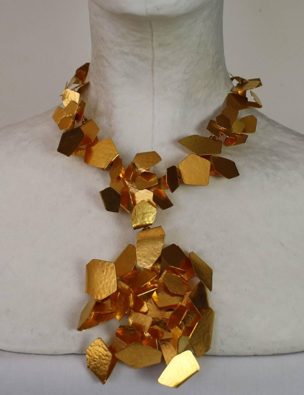 Herve van der Straeten choker necklace made from hammered brass-plated gold in an abstract design.

Designer Biography:

Hervé Van der Straeten was born in 1965 and is an independent artist-designer. Having first become known for his jewellery