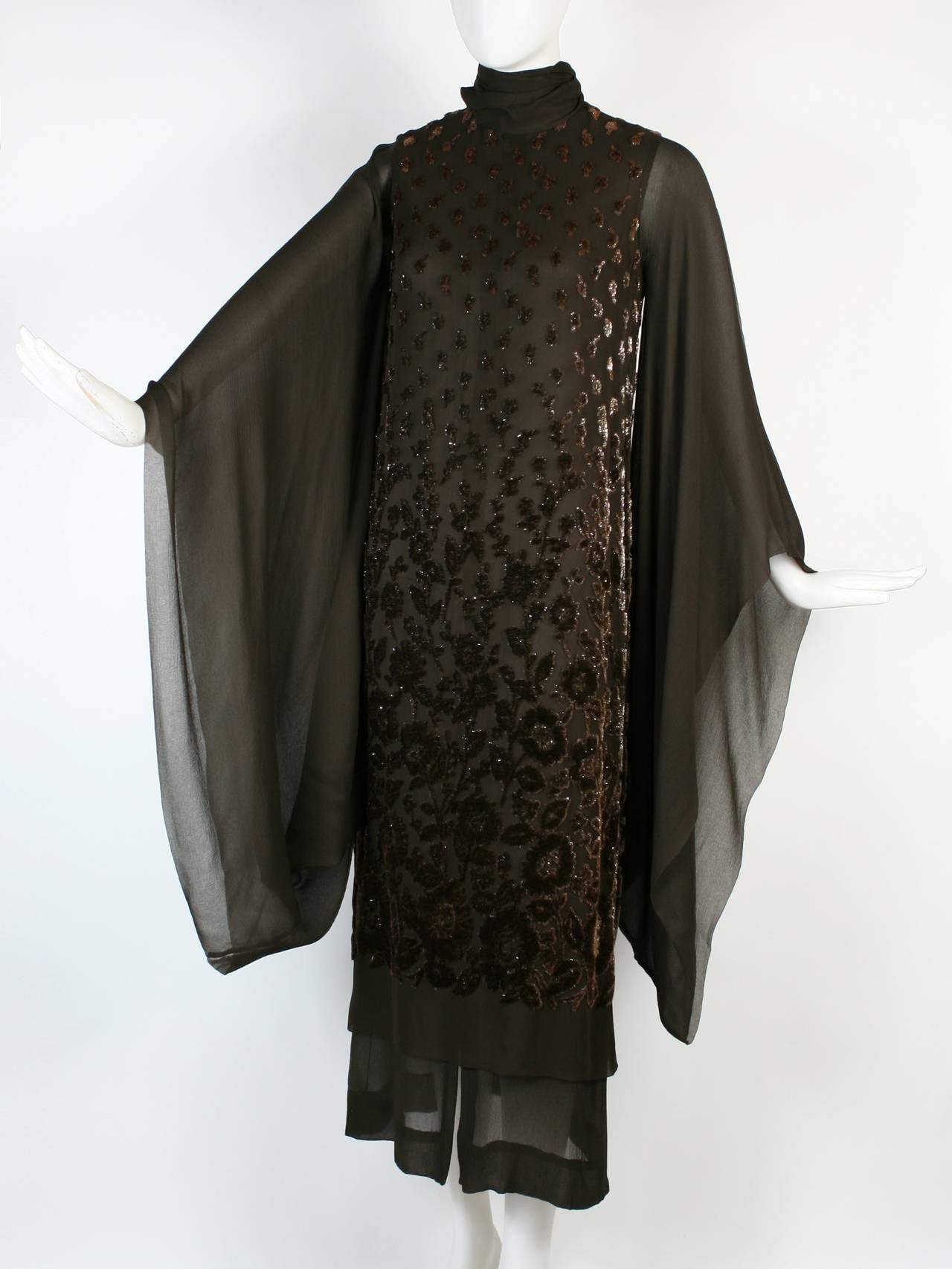 This stunning piece by Christian Dior is everything you would expect from a Haute Couture dress. Dates from 1969. The finest silk chiffon. Incomparable craftsmanship. A gorgeous dark chocolate brown with a devore effect. There is some shimmer in the