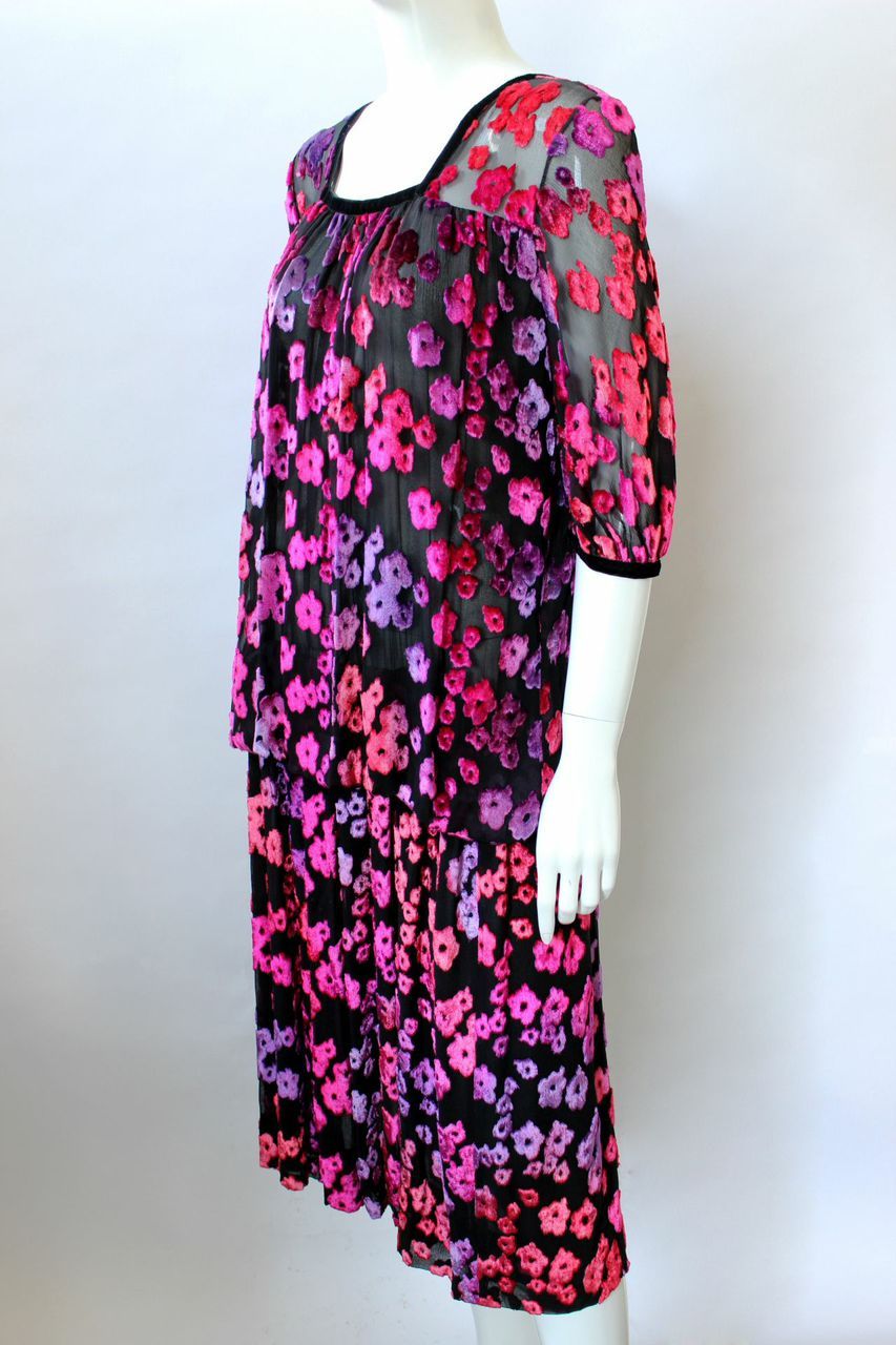 1970s black, pink and purple silk velvet devoré floral drop waist with blouson sleeves. Square neckline and cropped sheer sleeves are trimmed with black ribbon. Dress body is lined with another layer of black silk chiffon but is rather sheer