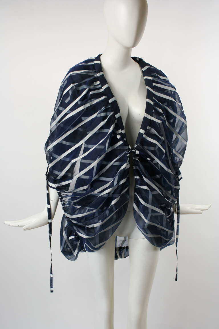 Issey Miyake Sculptural Avant-Garde Jacket. 
Striped blue and white jacket with adjustable ties at sleeves and back.
Has ingenius sculptured fabric manipulation. Ties at front. 
This a gorgeous piece perfect for any Issey Miyake collector.