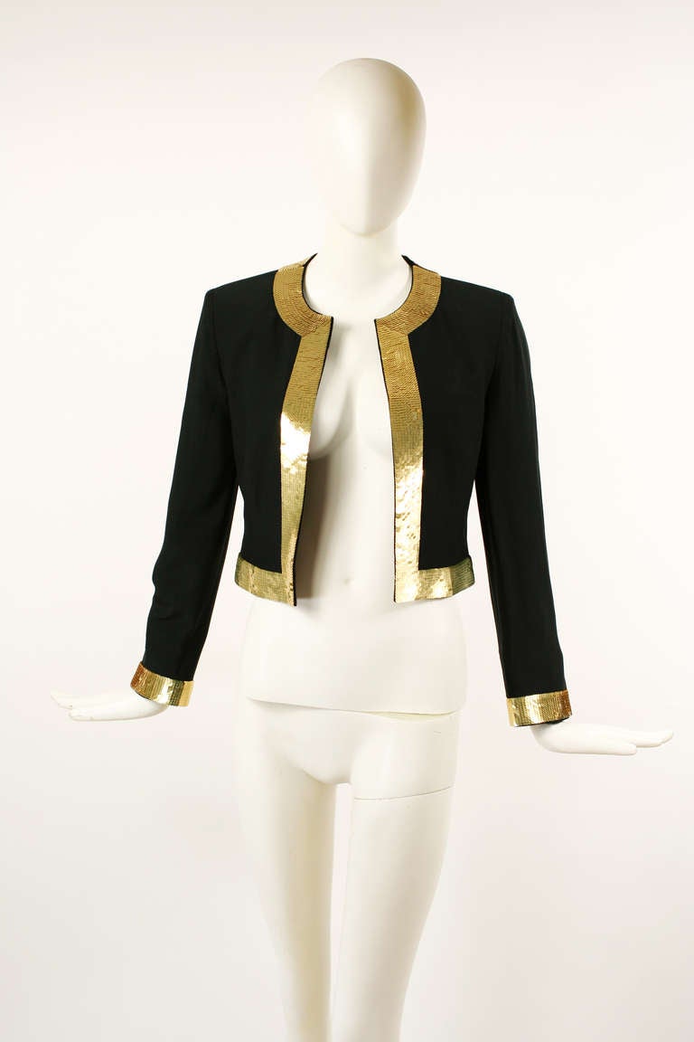 Moschino Couture! 1990's Black and Gold Sequins Blazer Jacket.
This is a great Moschino collectors item featuring gold sequins trim through out blazer. Stunning garment with expert tailoring and a perfect fit. 
Excellent Condition. Fits small to