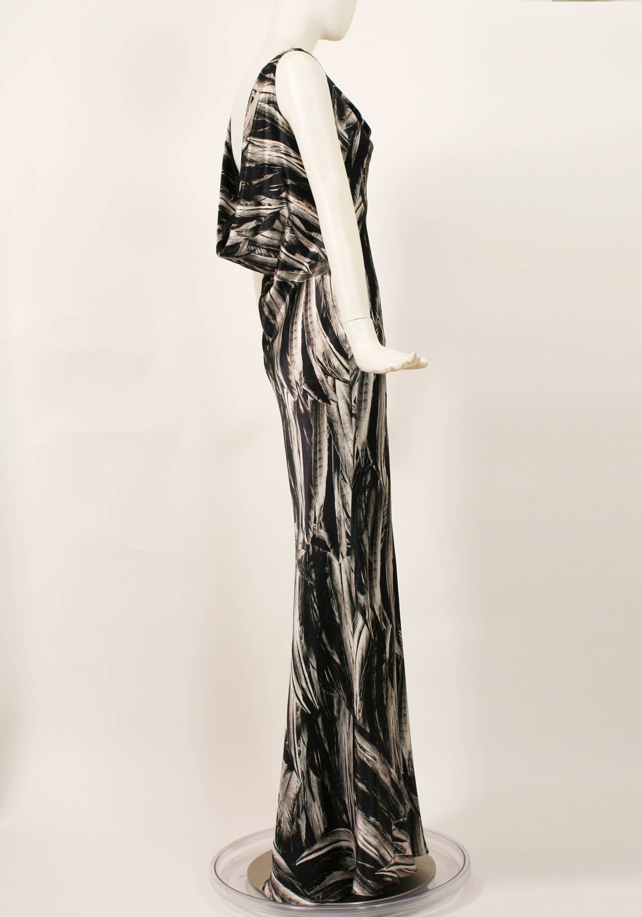 Alexander McQueen s/s 2009 Feather Print Silk Gown
A  magnificent dress with masterful draping. Bias cut with soft cowl at the front and a deeper plunge at the back. Feather print motif throughout. Excellent condition. Lined in black silk. Perfect