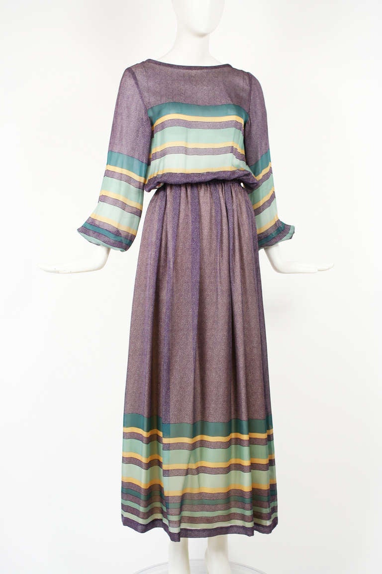 Louis Feraud silk chiffon dress made in the 1970s. Couture details. Mint Condition. Muted purple, teal and cream color palette. Gathered peasant blouson sleeves.

Store Location:

DEVORADO
436 E.9th St.
NYC, NY 10009
Store Hours: Mon-Sat