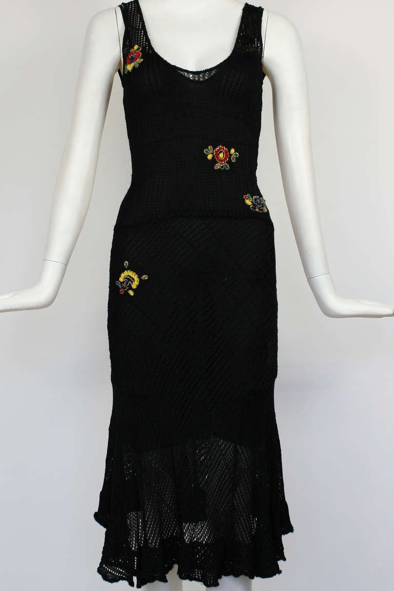 Christian Dior Black Open Knit Dress with Beaded Embroideries 

A gorgeous fitted open knit dress with gorgeous handwork. Perfect for resort wear. Sheer open knit can be worn with attached slip or other undergarment.
Viscose- Can be hand washed