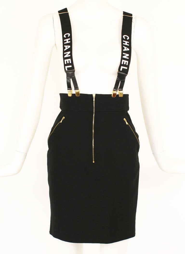 Chanel 1990's High Waisted Black Zipper Skirt
Fitted pencil silhouette. Made from viscose,silk and elastene. 
Zippered diagonal pockets and zippers in front and back. Very form fitting.
Season 28 
Size 36 
**This skirt has stretch**
High