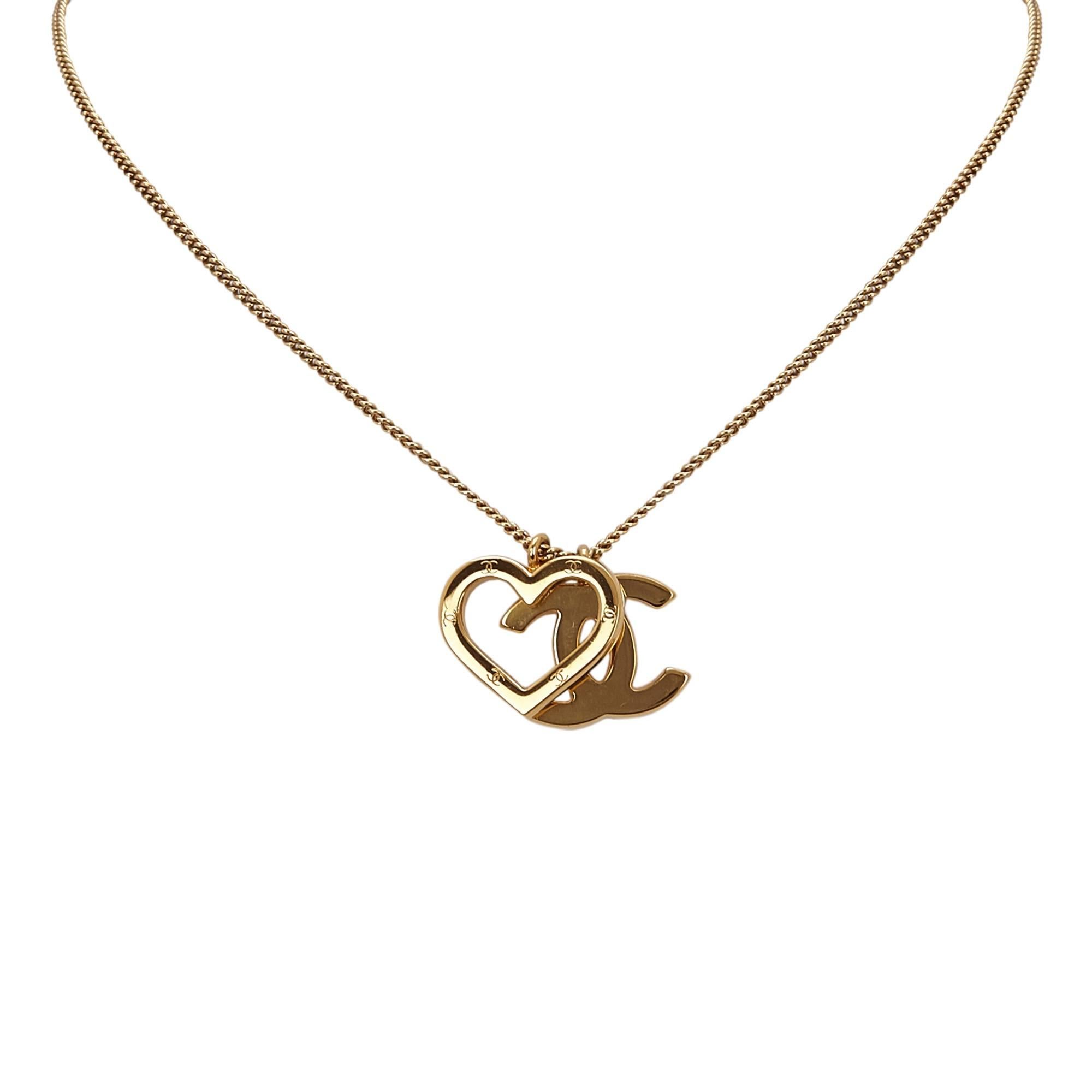 - This 2004 Chanel necklace features a gold-tone "CC" and heart pendant with a  springring closure.

- Made in France. 

- Size: 1.9cm x 1.5cm. 

- Circumference 42cm. 

- Include: Box. 

