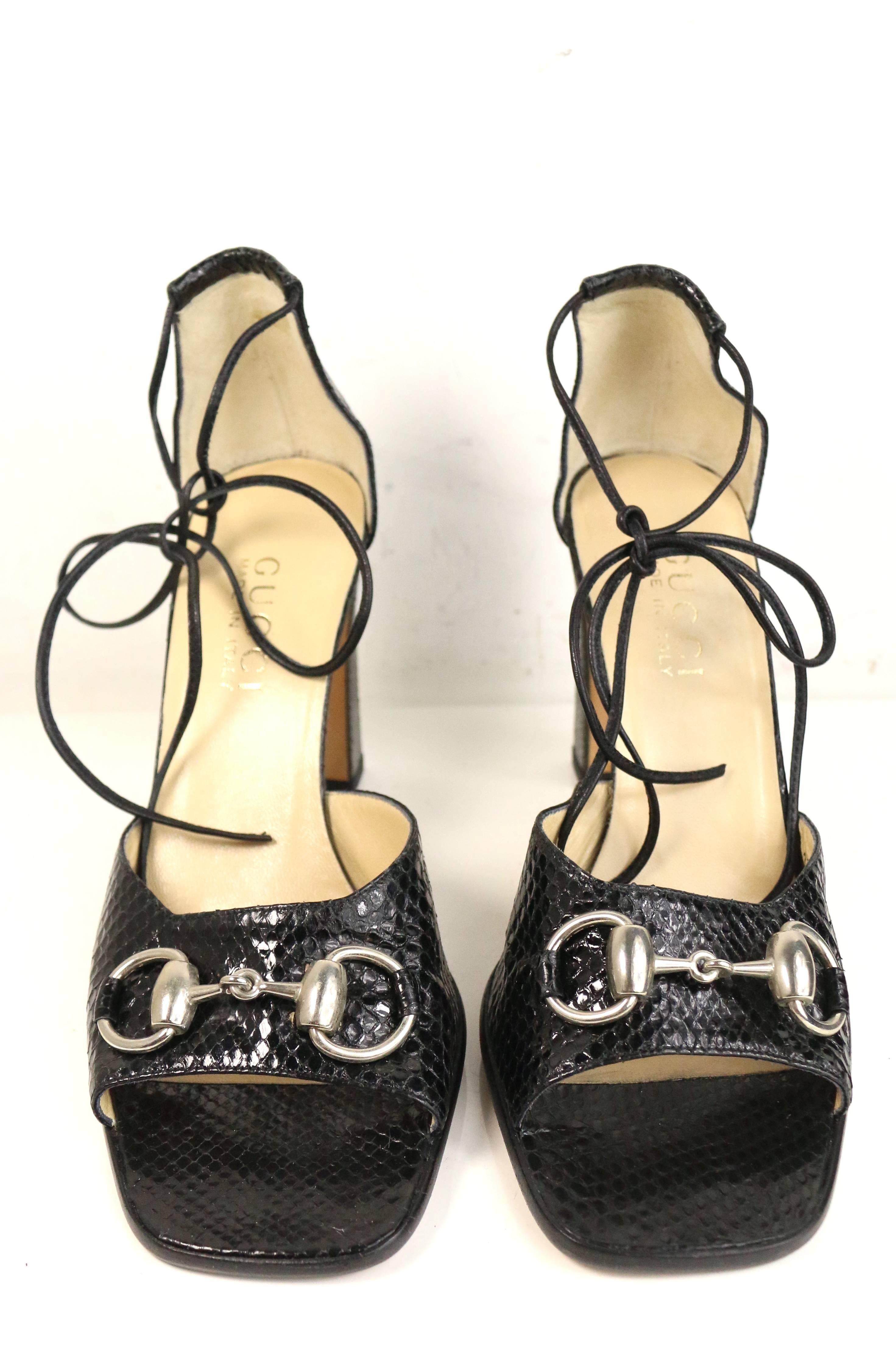 - Vintage Gucci by Tom Ford black python open toe sandals heels from Fall 1996 collection. Featuring the classic signature silver buckle and black lace up.  Tom Ford really knows how to make women look sexy all the time!!!   

- Made in Italy.   

-