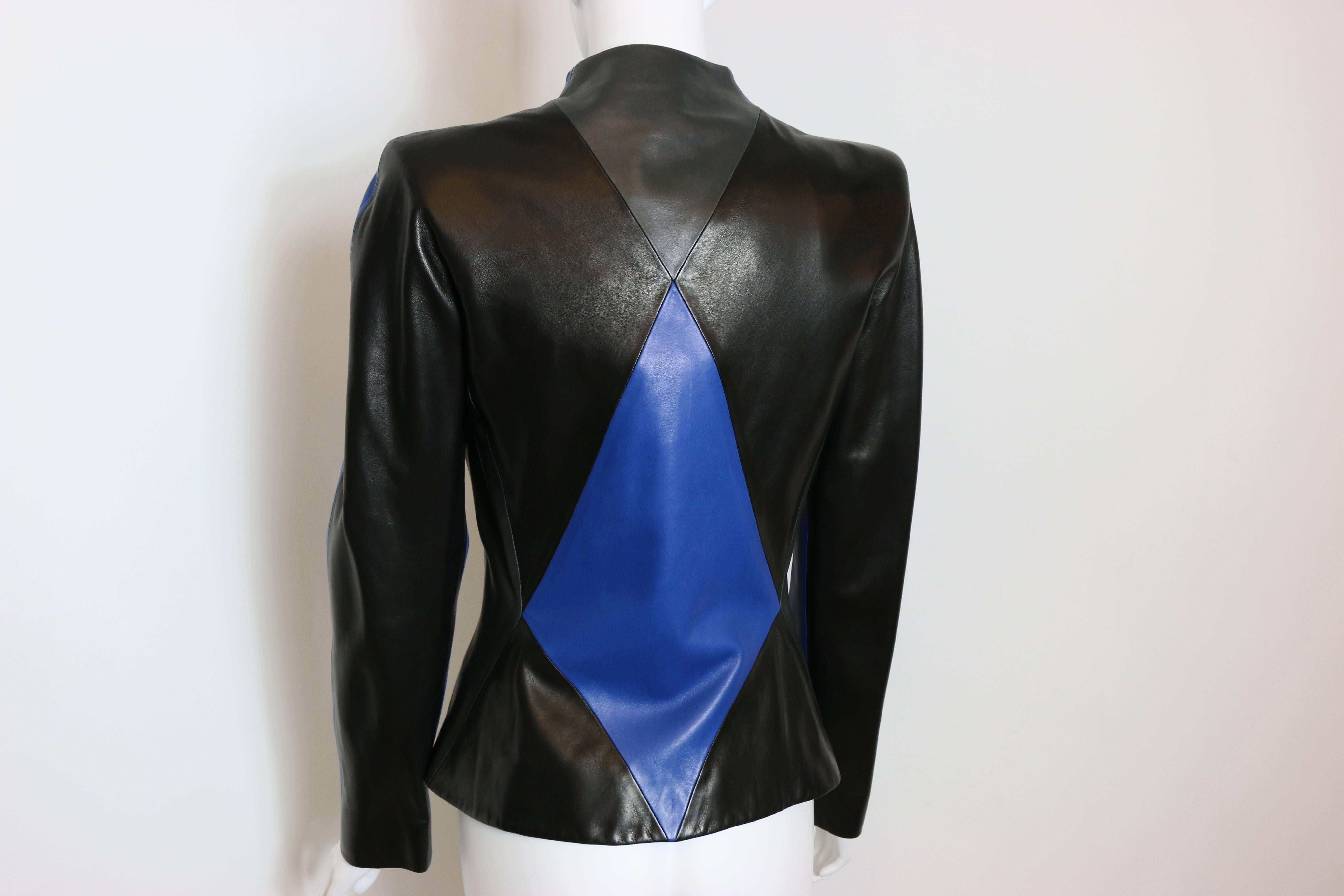 - Vintage 90s Hubert de Givenchy haute couture blue/black/grey colour blocked geometric patching leather jacket. 

- Round shoulders. 

- Boxy cut. 

- Five hidden panel buttons in front. 

- Height: 60 cm I Bust: 36cm I Waist: 66cm I